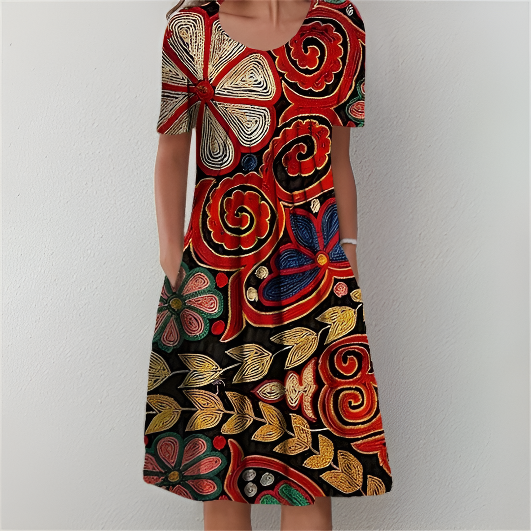 RUBY – FLOWING FLORAL DRESS WITH FLATTERING TUMMY COVERAGE