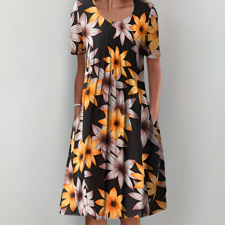 RUBY – FLOWING FLORAL DRESS WITH FLATTERING TUMMY COVERAGE